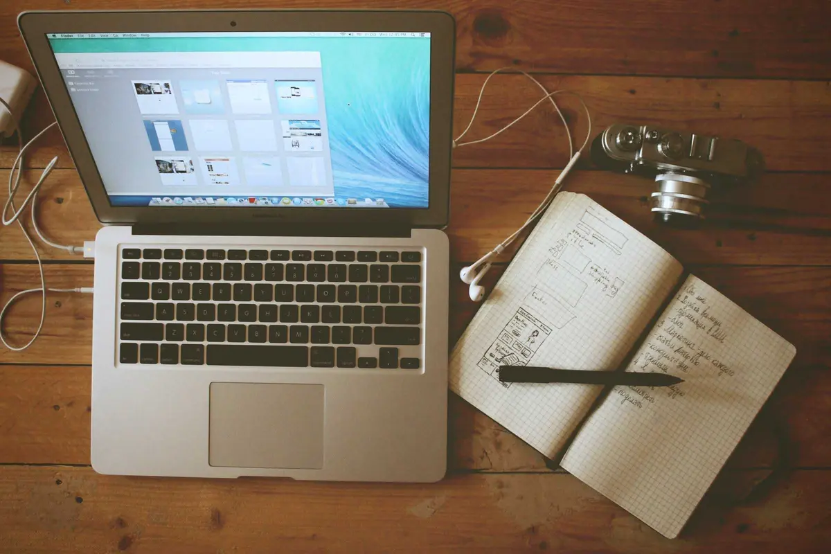 Demo photo: a laptop and an open notebook