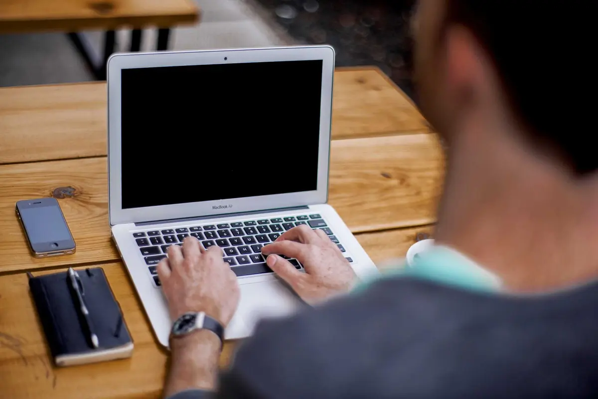 Demo photo: a developer at a laptop